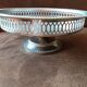 Old metal bowl on foot