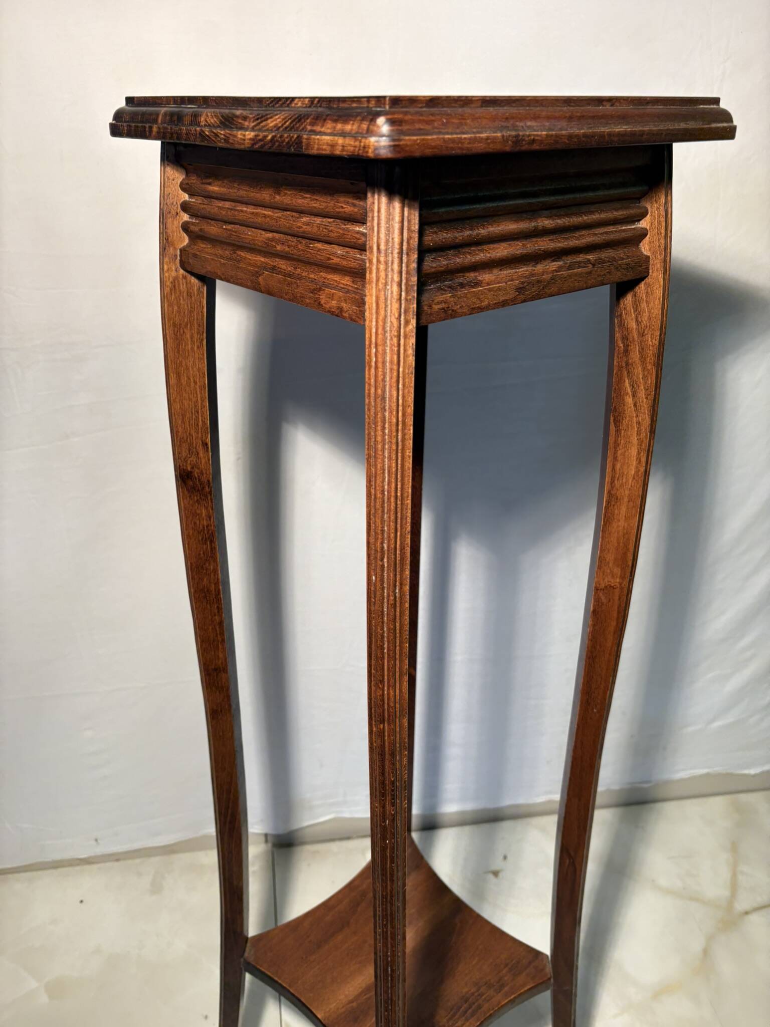 Vintage dark wood side table with curved base
