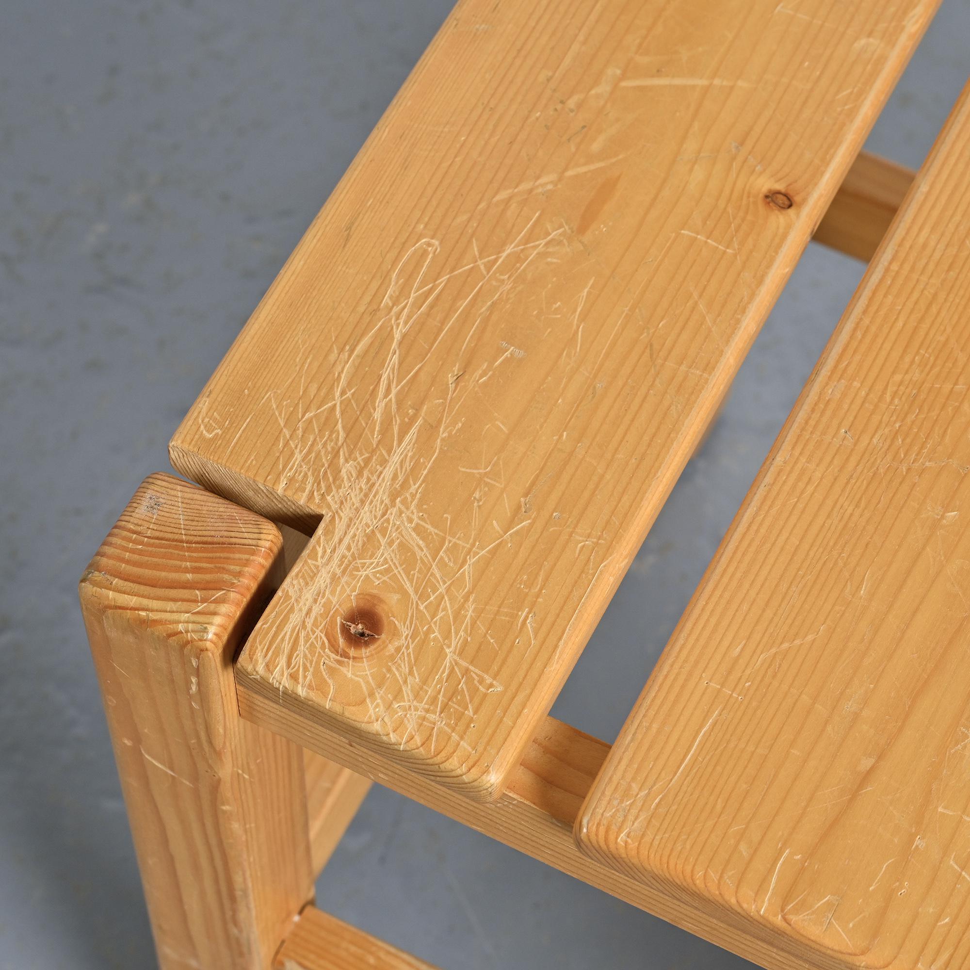 Set of four solid pine chairs by Maison Regain.