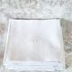 12 antique French linen towels with damask embroidery with "GB" anagrams.