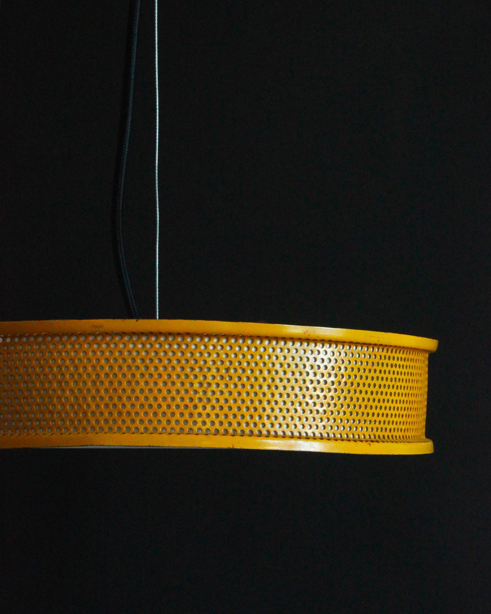 Yellow lacquered perforated metal pendant, in the style of Matégot or Biny.