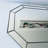 Old octagonal beveled mirror with parcloses