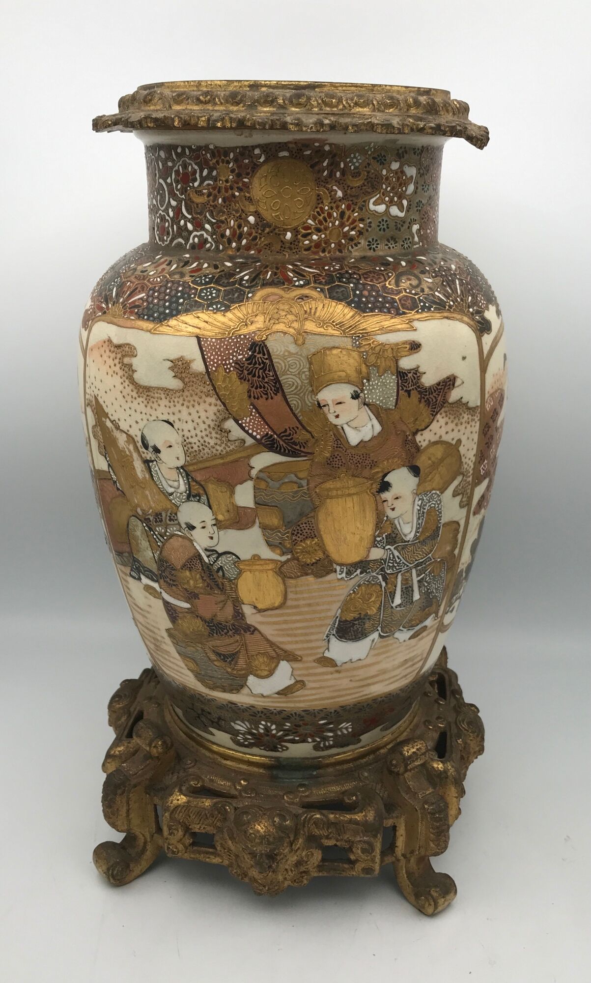 Old satsuma ceramic vase with various decorations mounted on bronze