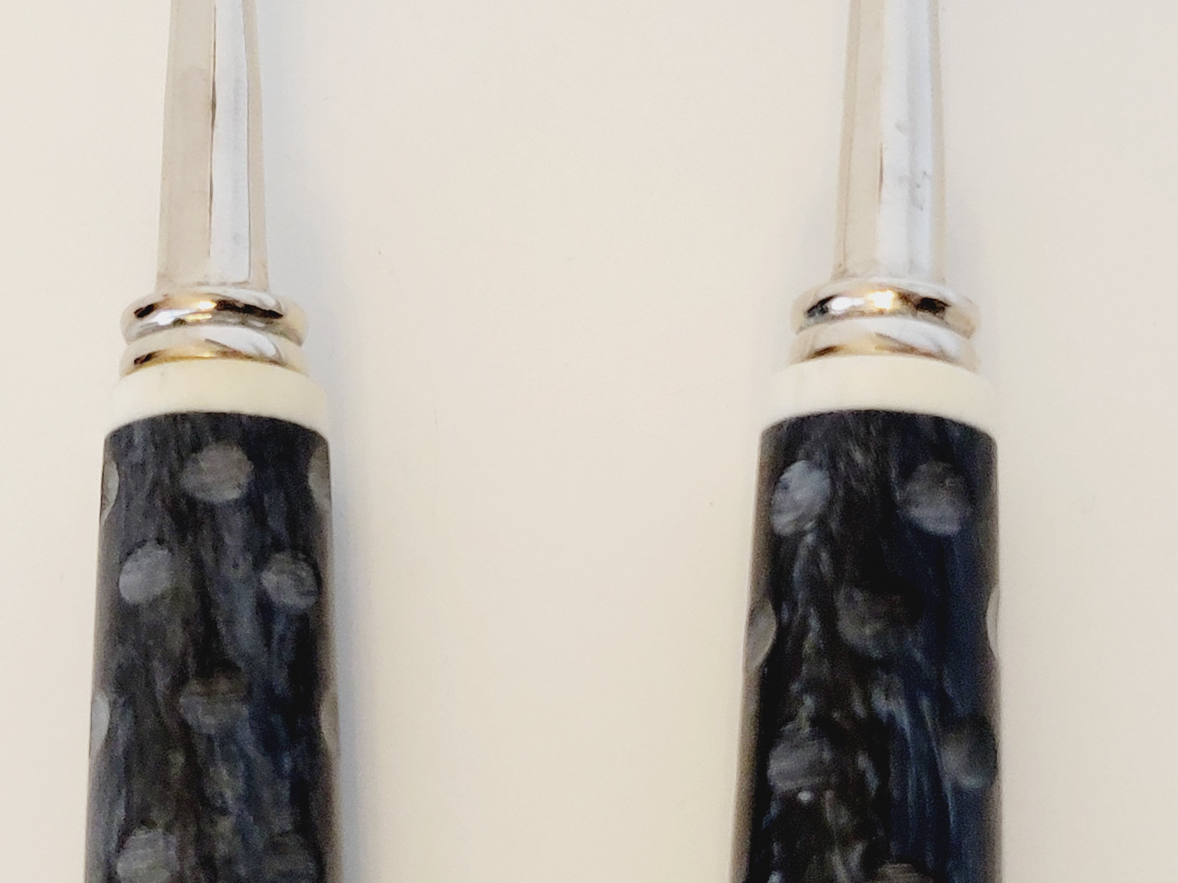 Set of salad serving cutlery in silver metal and resin