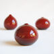 Trio of red miniature ceramics by Antonio Lampecco