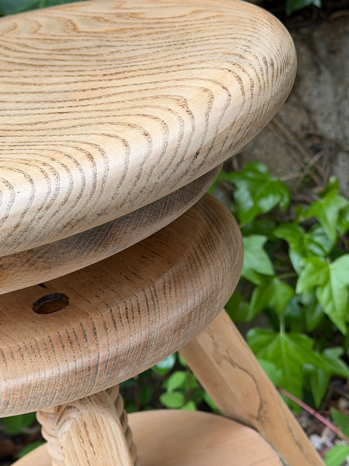 1950s solid oak tripod workshop stool with a screw mechanism.
