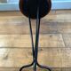 Vintage tripod harness round wooden top on black lacquered metal stand