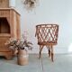 Old tripod rattan plant holder