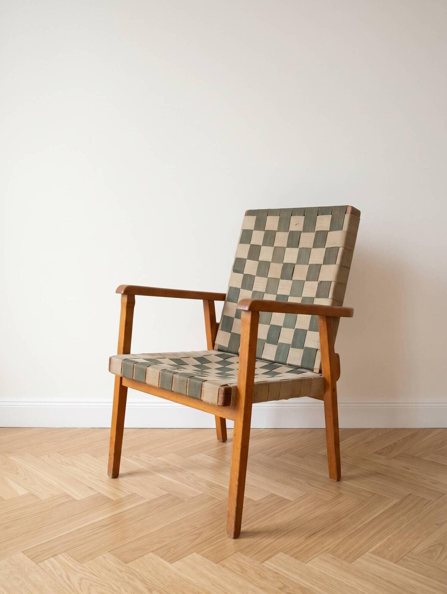 Vintage Scandinavian armchair in wood and woven strap.