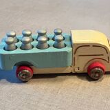Small wooden milk truck with its cans, antique toy