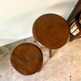2 tripod stools with dark wood screws
