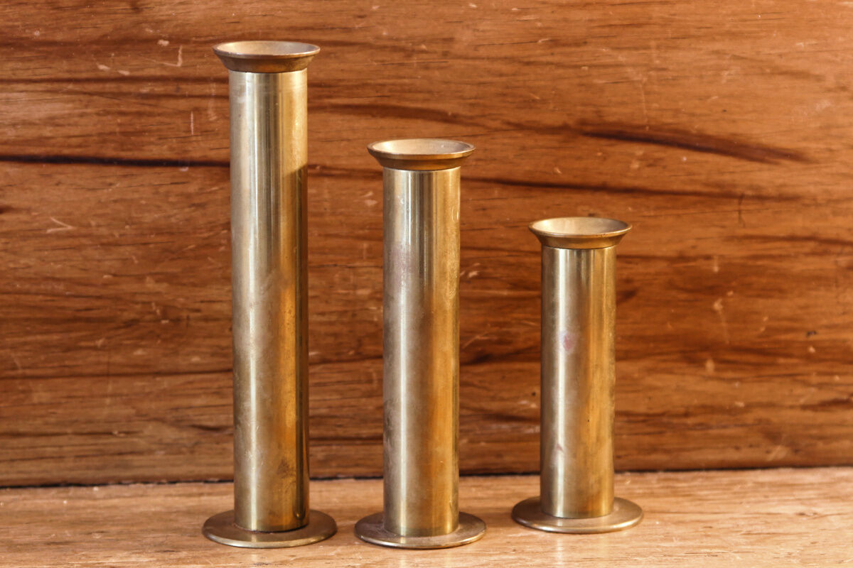 Trio of brass candle holders