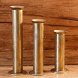 Trio of brass candle holders