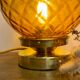 Vintage amber glass globe laying lamp with brass detail