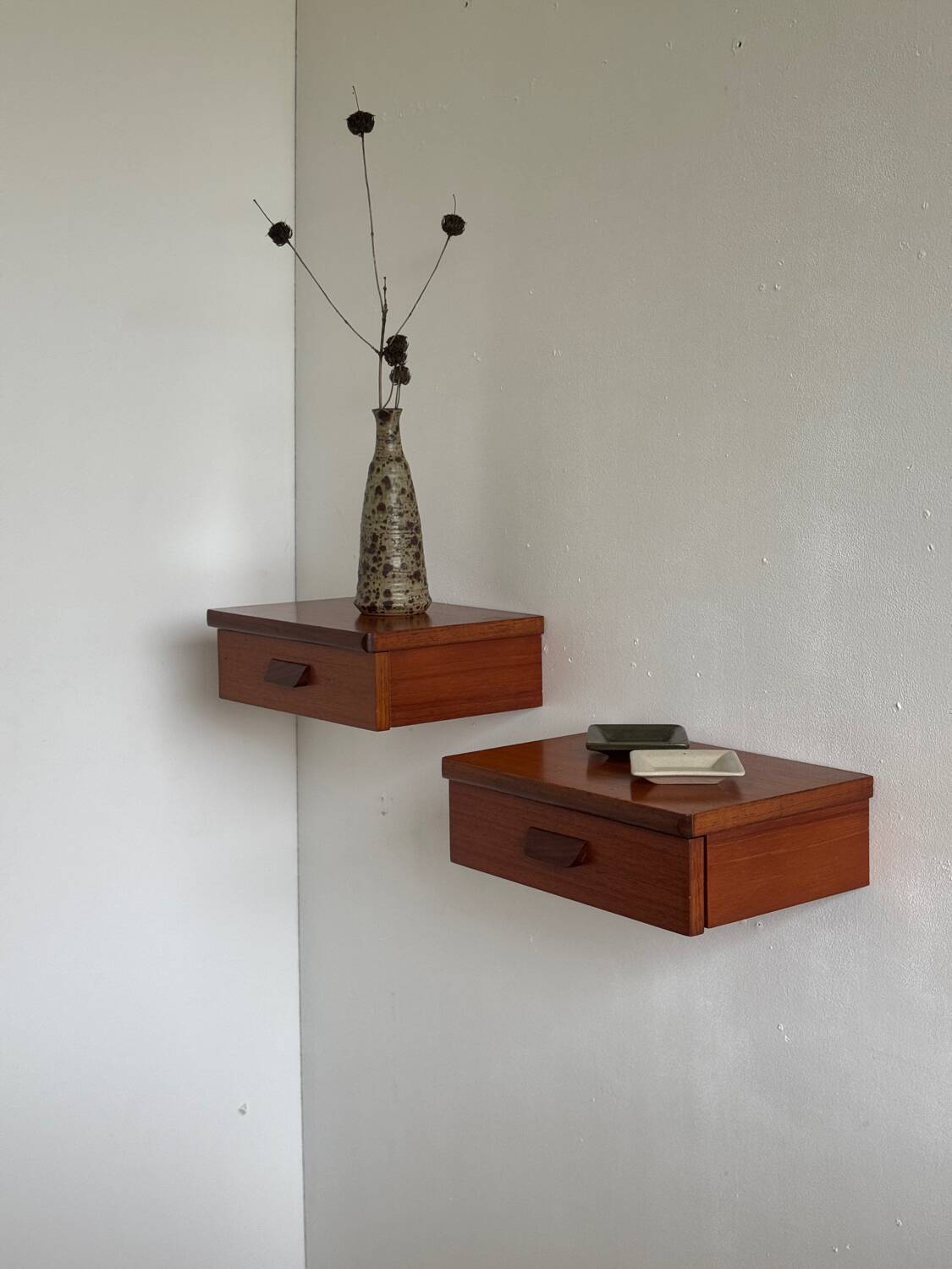 Vintage Scandinavian teak wall-mounted bedside tables.