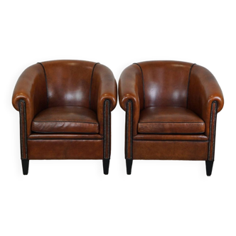 Set of 2 desirable sheepskin leather club armchairs with a beautiful appearance