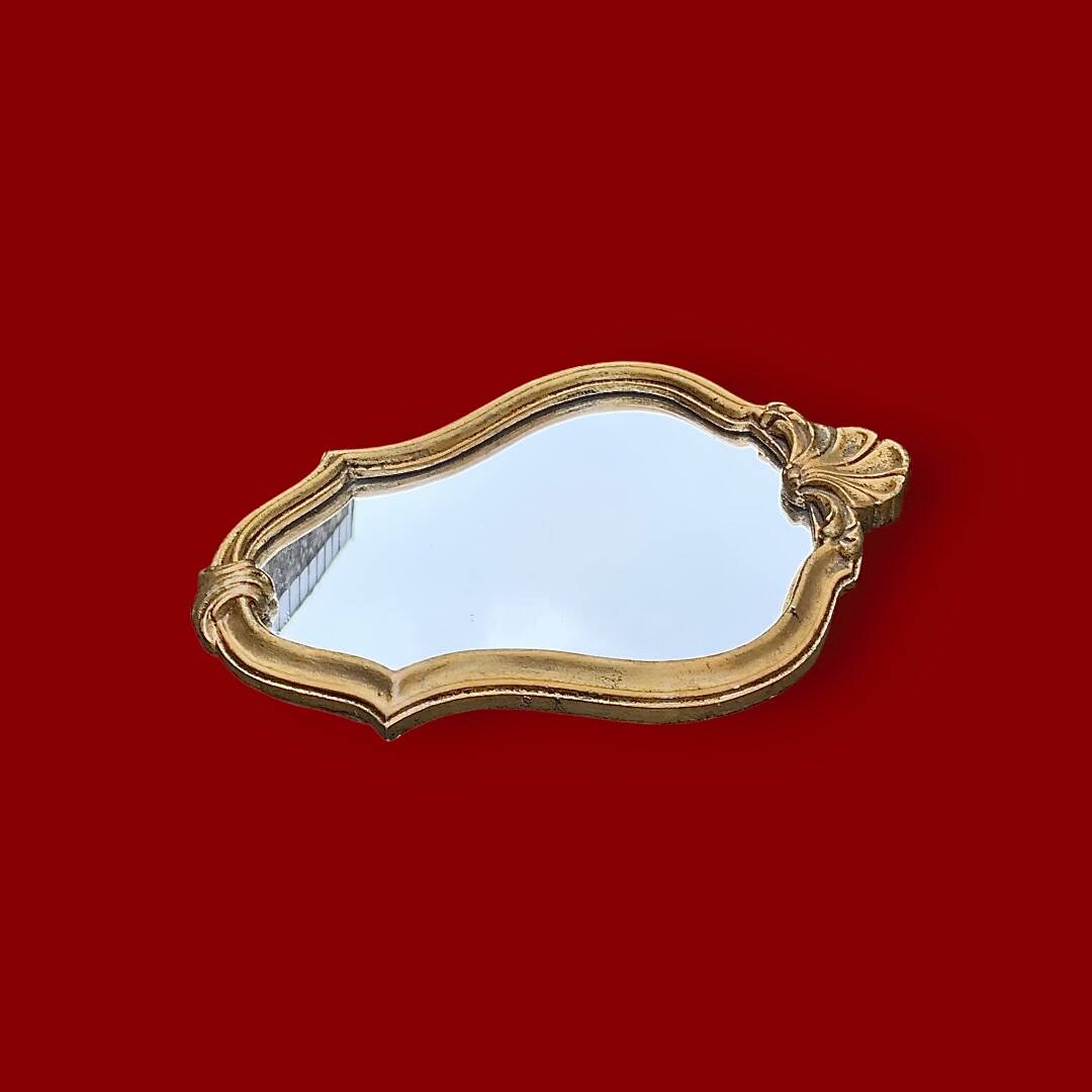 Small vintage rockery wall mirror in golden resin