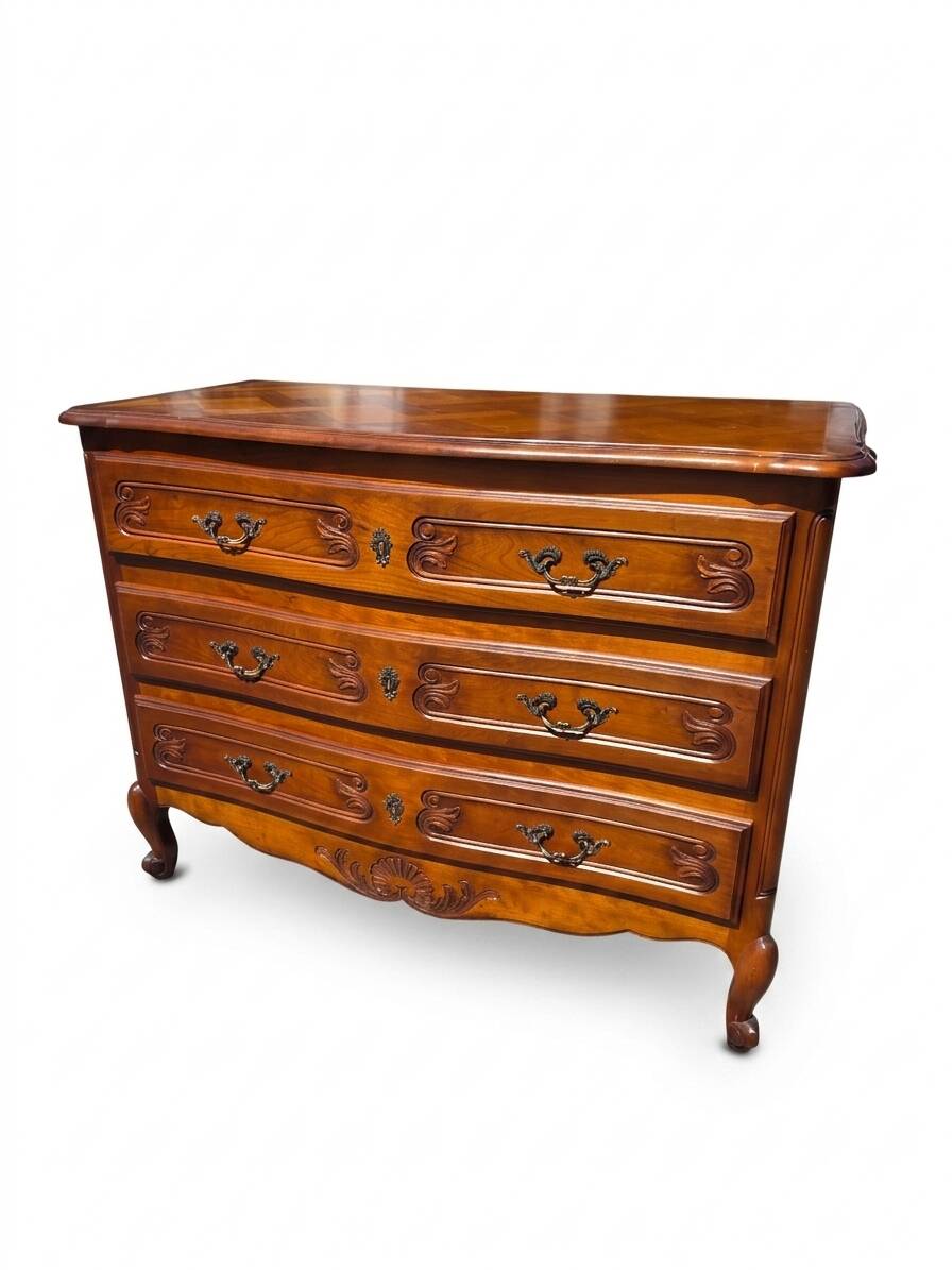 Curved commode in Louis XV style made of cherry wood.