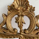Antique mirror in stuccoed and gilded wood - rocaille style - France 50x86cm