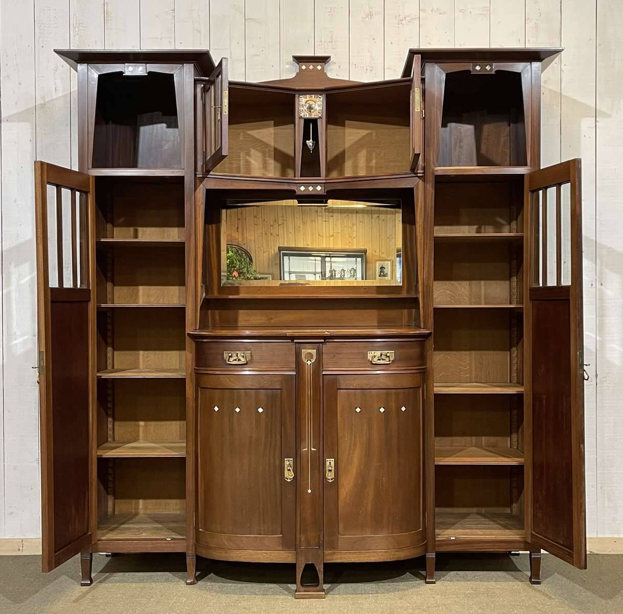 Art Nouveau mahogany buffet with clock in the style of G. Serrurier Bovy.