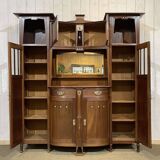 Art Nouveau mahogany buffet with clock in the style of G. Serrurier Bovy.