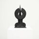 Black brutalist wooden sculpture