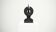Black brutalist wooden sculpture