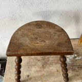 Wooden tripod farm stool