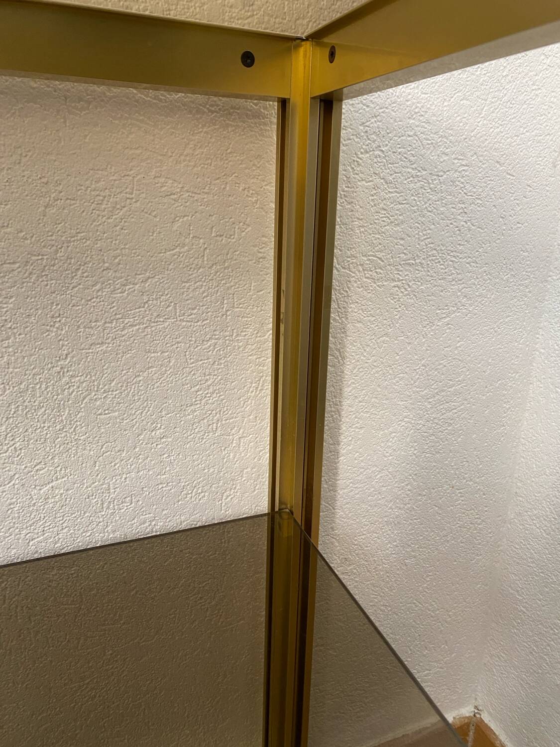 Regency style console table, in gilded metal and smoked glass