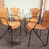 4 vintage wrought iron rattan chairs.