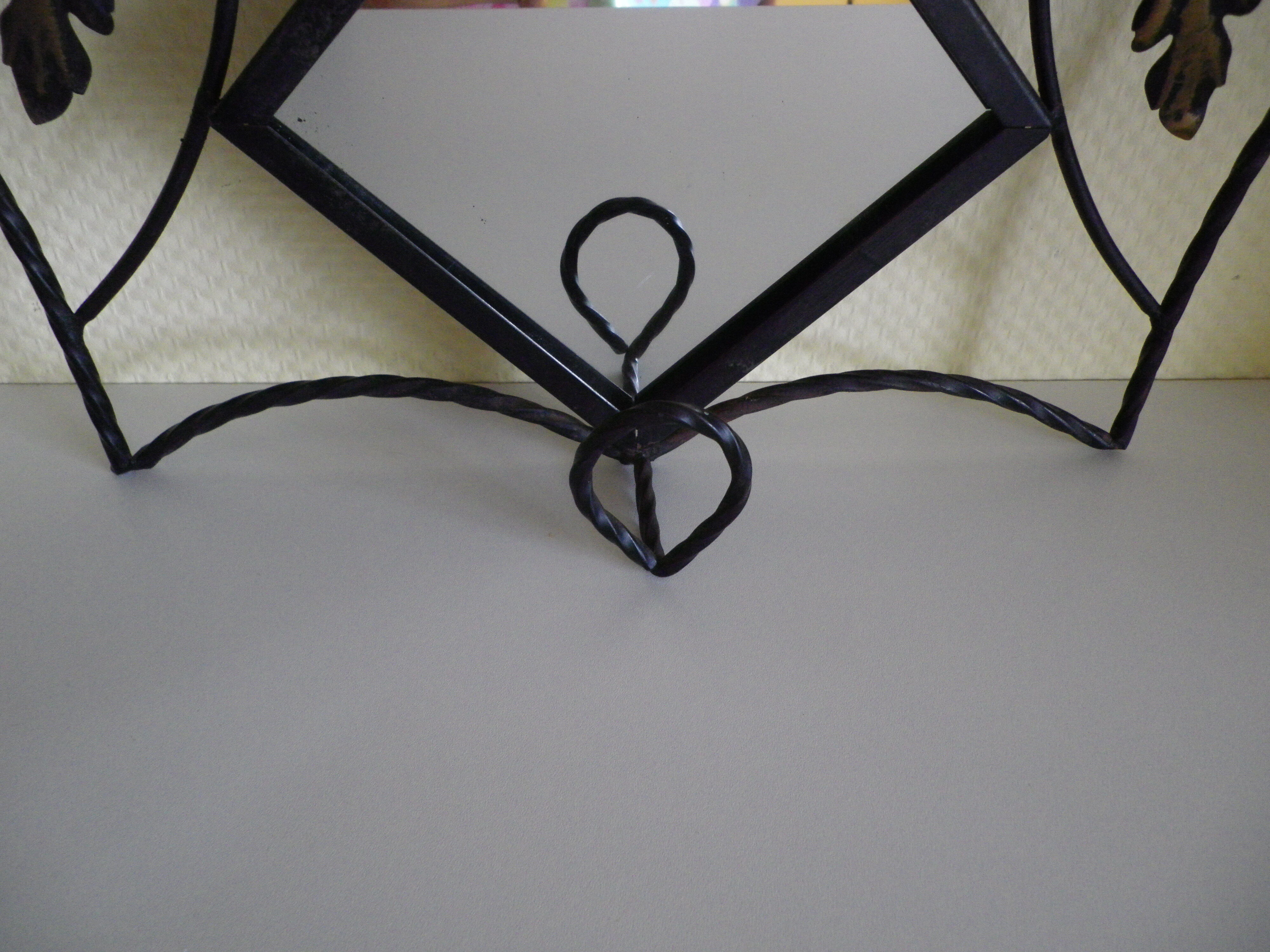 Wrought iron wall holder with top support and built-in mirror