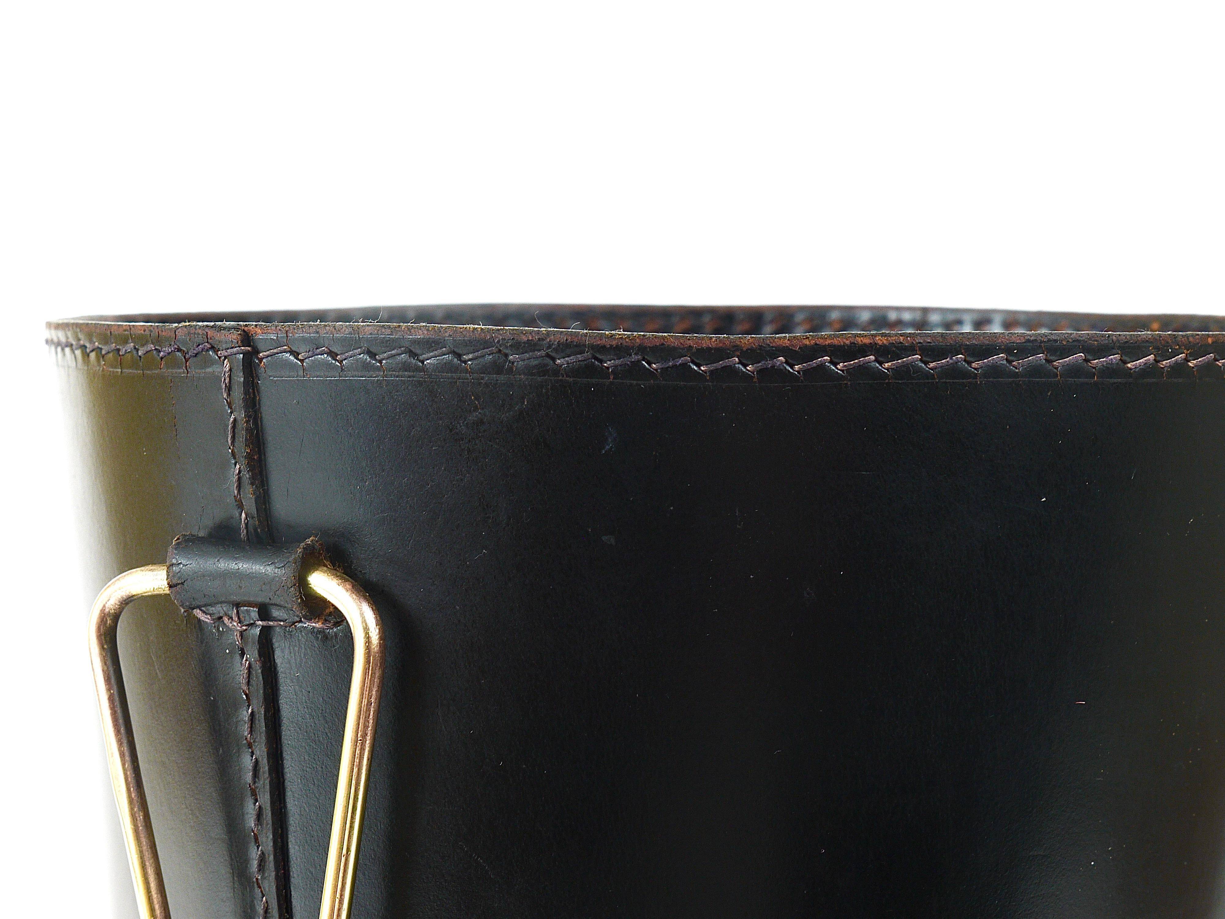 Mid-Century paper bin by Carl Auböck in black leather and brass, Austria, 1950s.