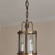 Cylindrical brass and glass lantern in Louis XVI style.