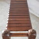 Bench with slats and feet of charpoy beds in teak