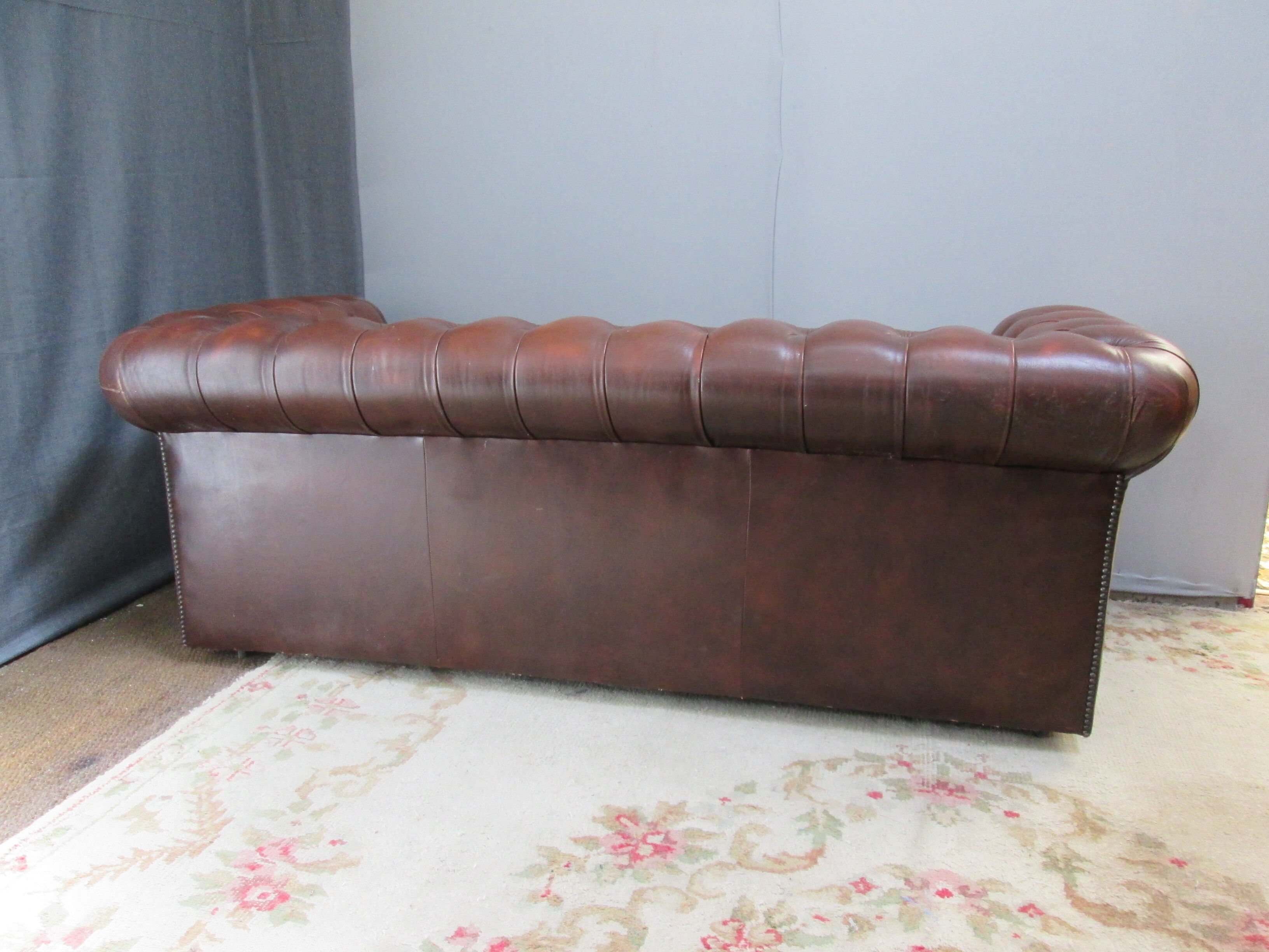 Brown leather chesterfield sofa