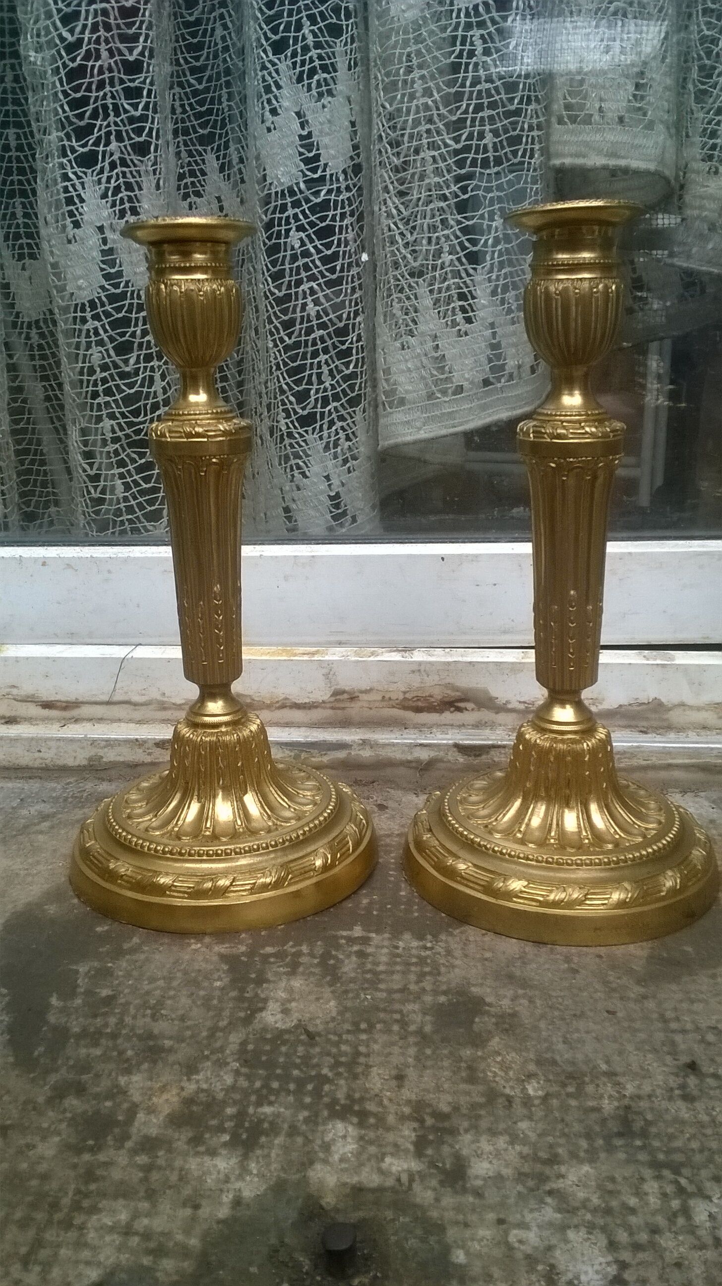 Pair of golden bronze candlesticks