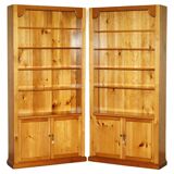 Pair of vintage cherry wood bookcases with lockable doors.