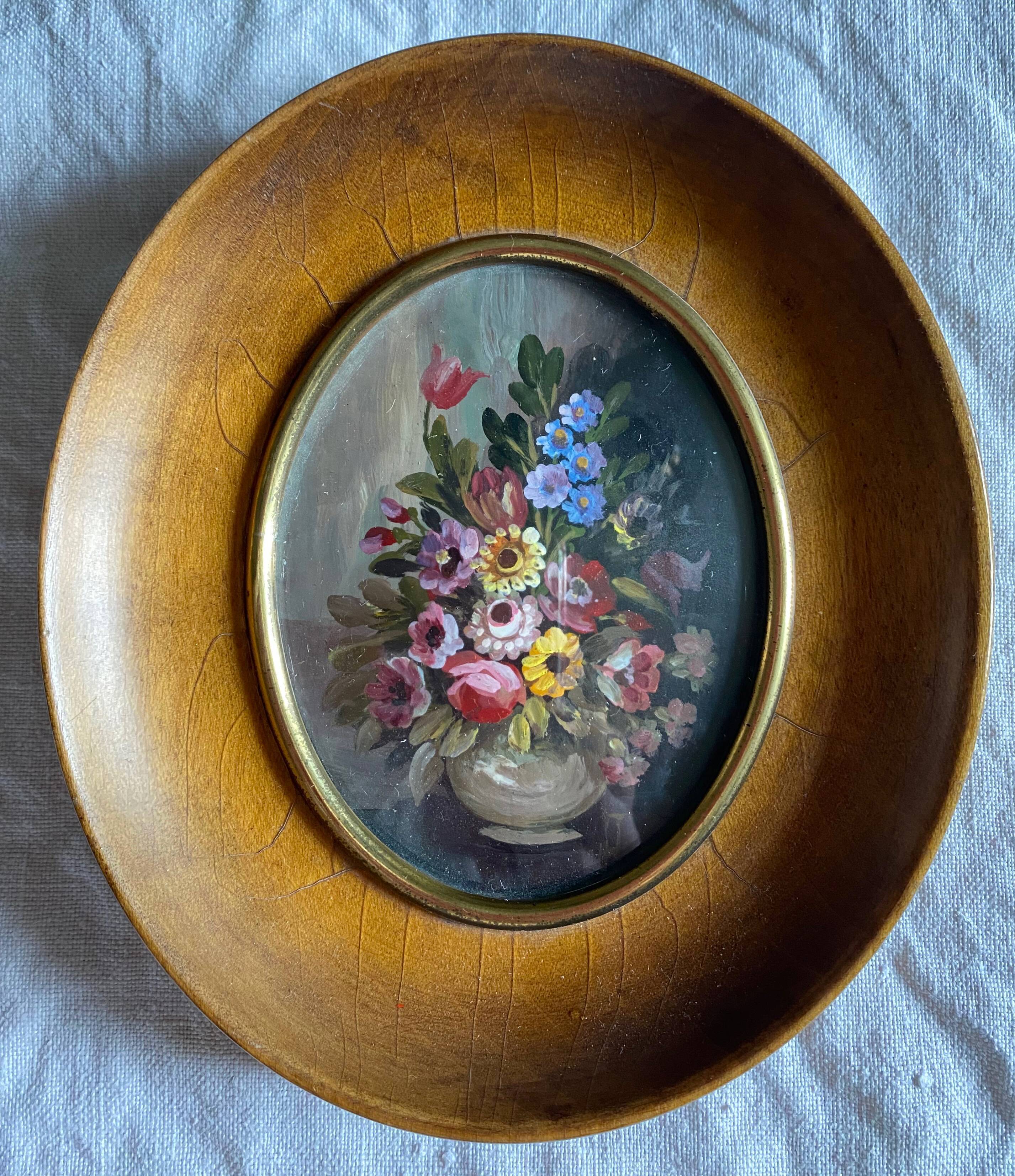 Old painting "bouquet of flowers" with oval frame and glass