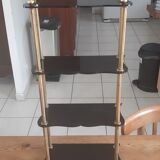 Vintage shelf of the 60s in golden metal and black plastic