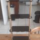 Vintage shelf of the 60s in golden metal and black plastic
