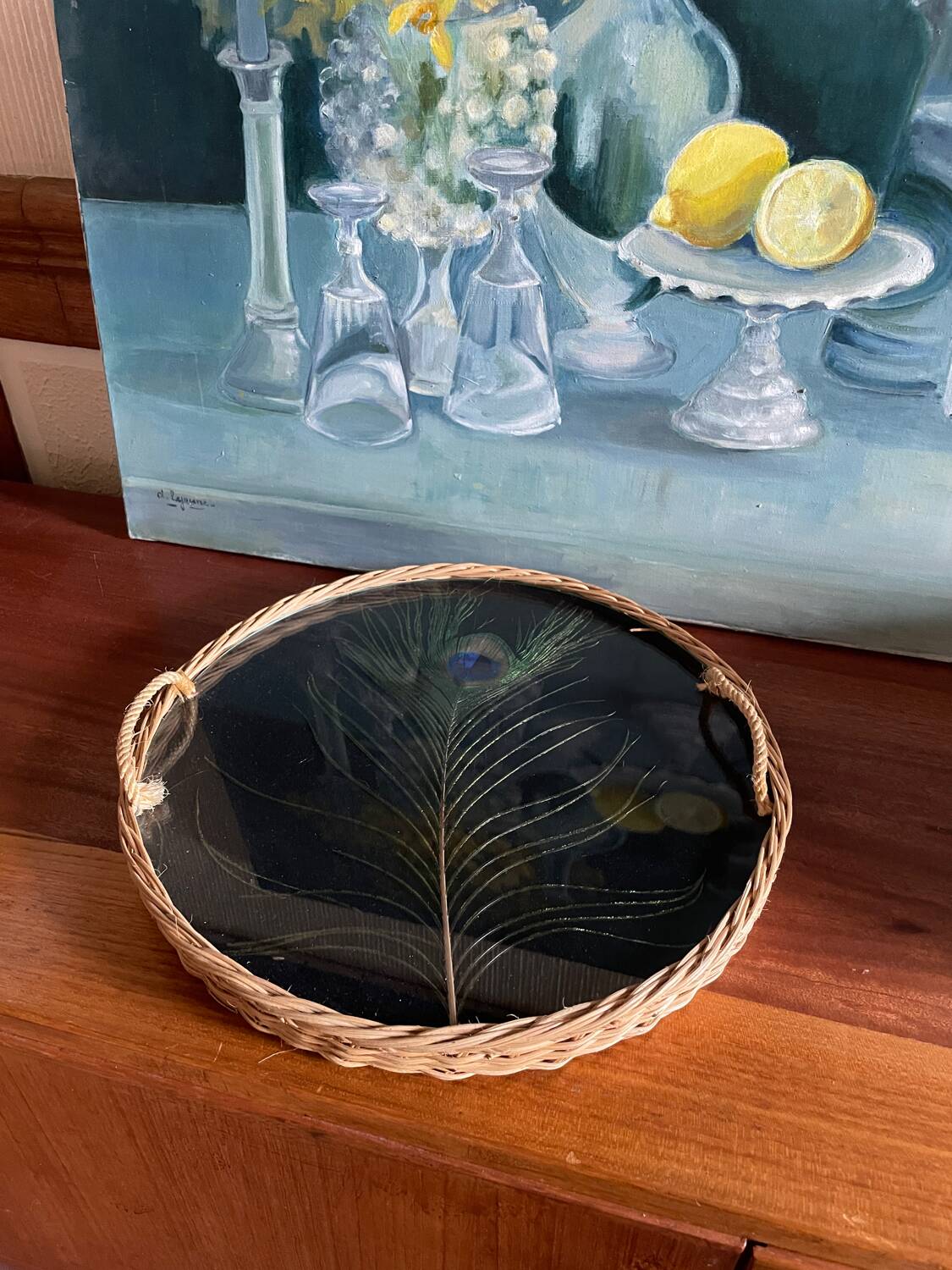 Vintage rattan tray with peacock feather