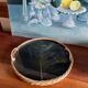 Vintage rattan tray with peacock feather