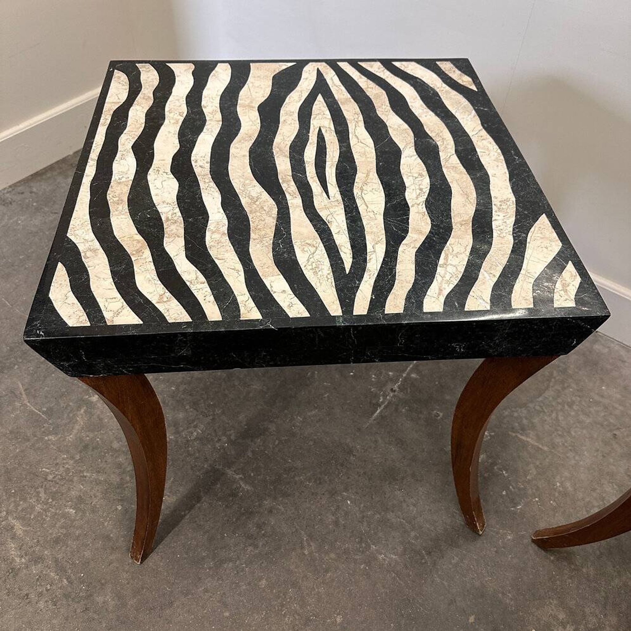 Striking pair of Italian zebra inlaid tessellated stone tables with refined curves