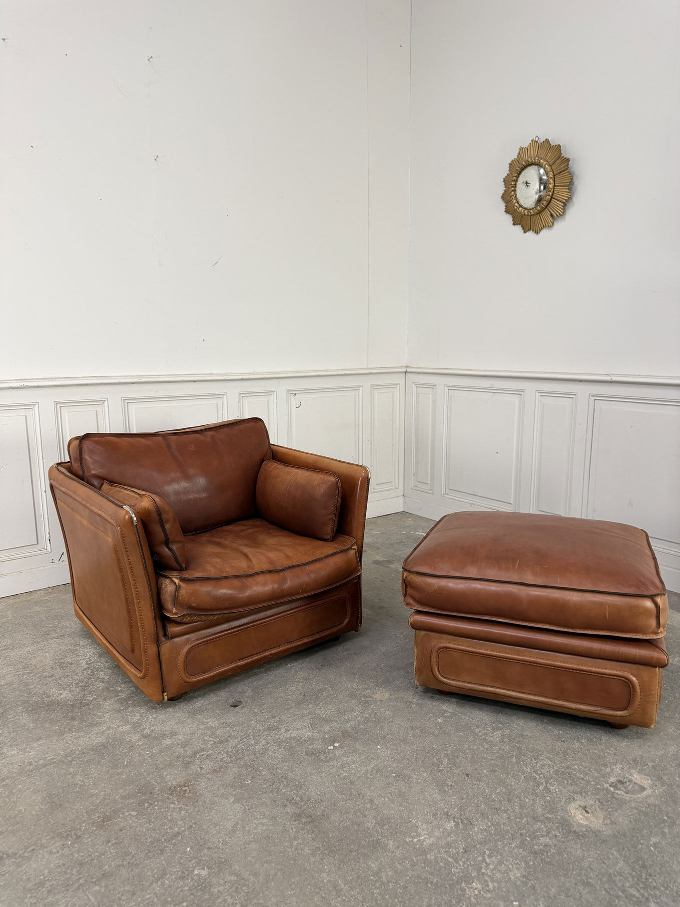 Club armchair and its ottoman 1980s