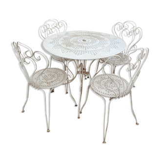 Table de jardin en fer forgé et ses 4 chaises