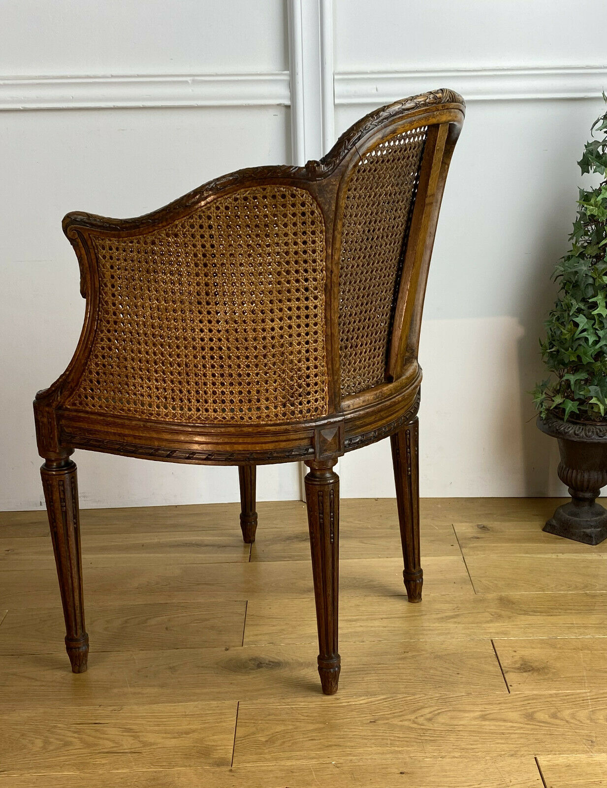 Old armchair with double cannage in walnut carved style Louis XVI of the nineteenth century