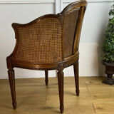 Old armchair with double cannage in walnut carved style Louis XVI of the nineteenth century