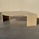 Large designer coffee table in travertine, eye shape, Roche Bobois edition from the 80s