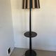 Vintage floor lamp in black patinated wood and striped lampshade