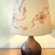 Important wooden floor lamp with a lampshade decorated with flowers from around 1970.